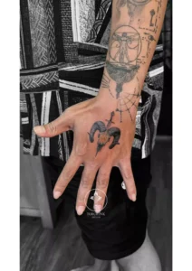 Graphic tattoo on lower arm